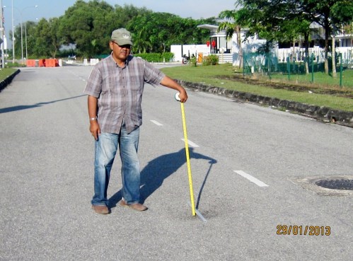 The deep of depression is about 75mm as measured by road contractor Aziz Ahmad